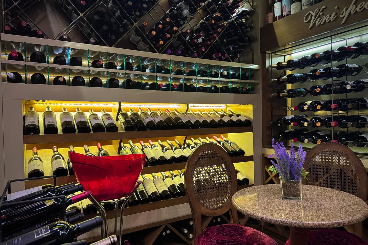 Backlit shelves in the wine cellar at Le Chalet de la Fondue in Gramado