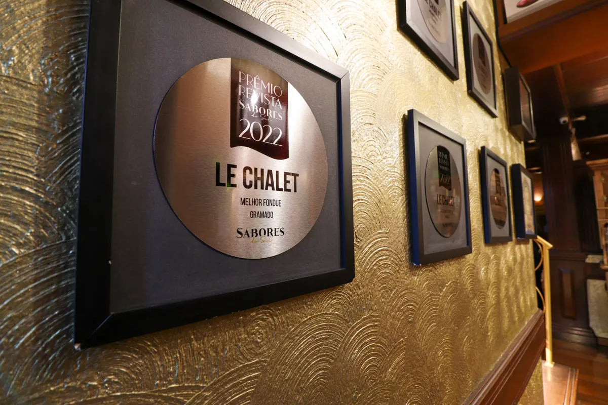 Wall of awards at Le Chalet de la Fondue restaurant