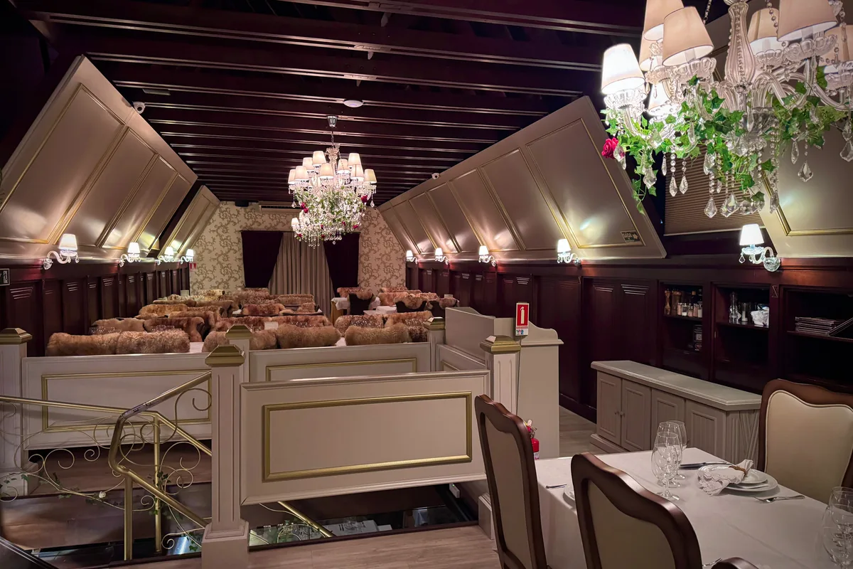 The mansard room at Le Chalet de la Fondue seen from the mezzanine